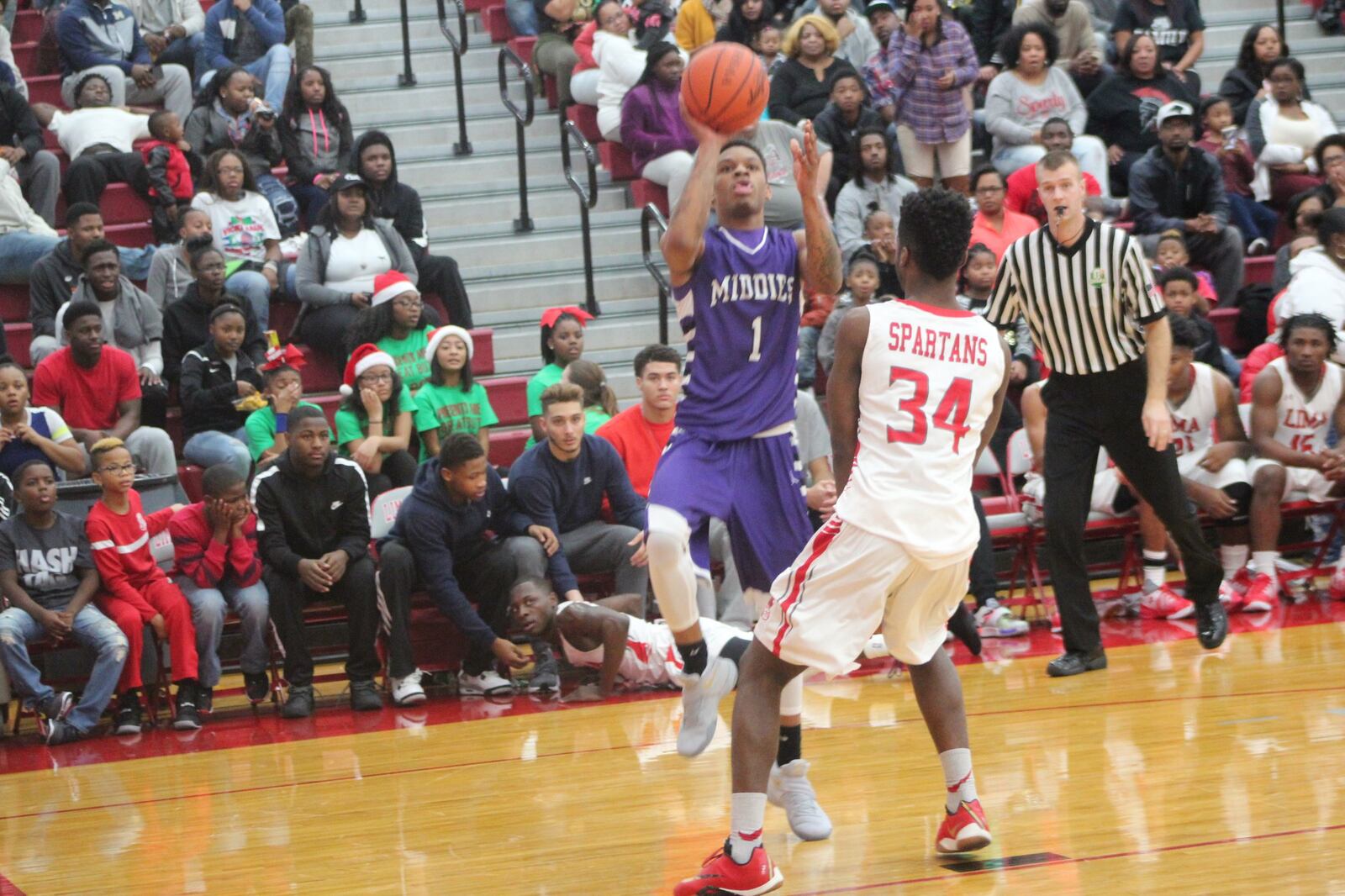 Middletown’s Nelson Rutledge (1) shoots over Lima Senior’s Tydus Chustz on Friday night in Lima. CONTRIBUTED PHOTO BY MARITZA MCKINNEY