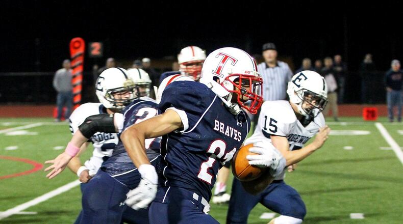 Talawanda running back Maurice Thomas (21) runs for his second touchdown in Friday night’s game against Edgewood at Talawanda High School in Oxford Oct. 18, 2013. NICK DAGGY / STAFF