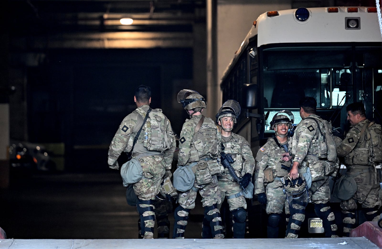Members of the U.S. military take a break at the downtown Metropolitan Detention Center Tuesday, June 17, 2025, in Los Angeles. (AP Photo/Wally Skalij)