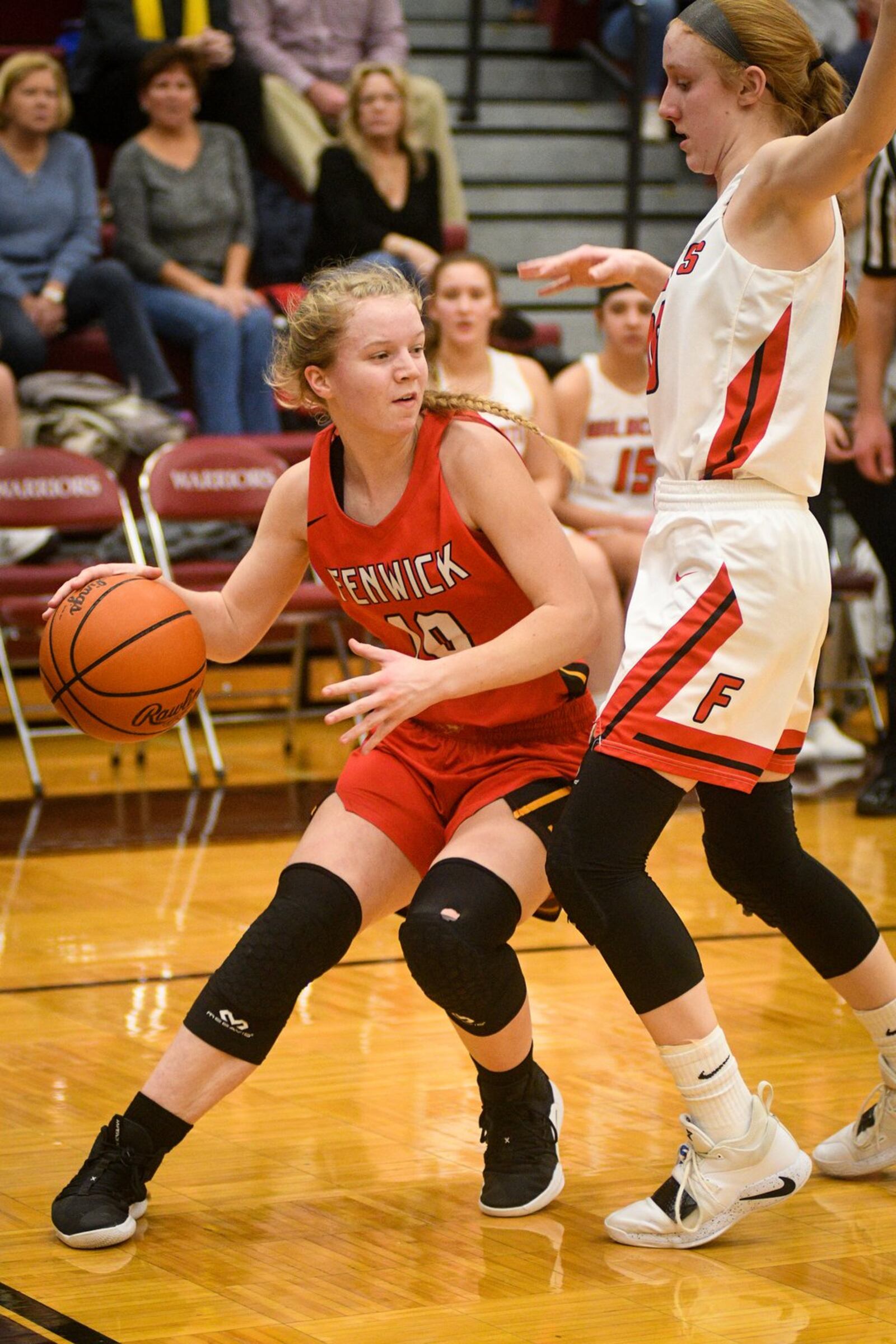 Fenwick’s Rachel Tebbe (left) tries to drive around Franklin’s Jordan Rogers during Monday night’s Division II district basketball semifinal at Lebanon. Franklin won 47-35. ROB MCCULLEY/RAM PHOTOGRAPHY