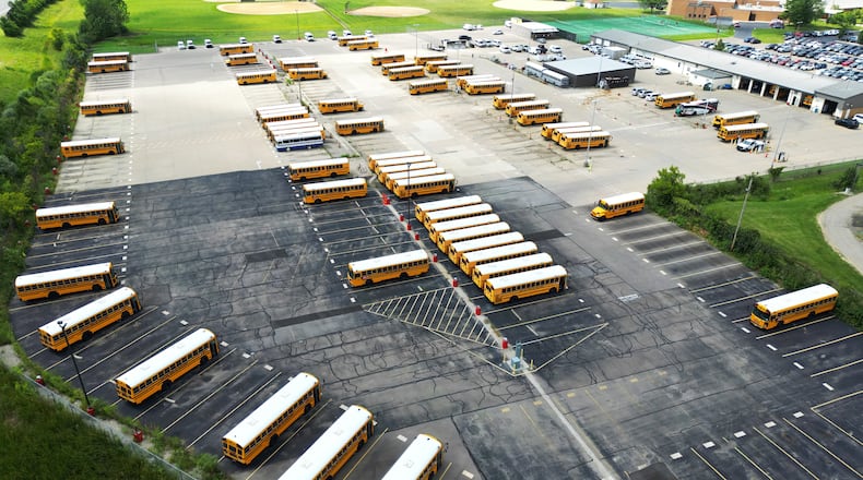 Lakota Schools buses are seen Thursday in the bus lot in Liberty Twp. In a letter sent to school families in the 17,500-student district, which is the second most populous in southwest Ohio and ninth largest in the state, the leader of Lakota said parents should be prepared for the cessation of all busing on Friday. NICK GRAHAM/STAFF