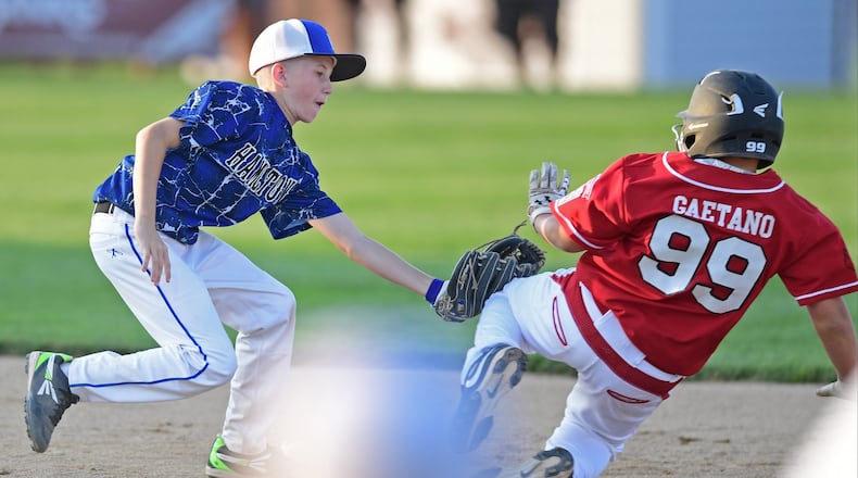 Hamilton West Side shortstop Cayden Evans tags out Gianni Gaetano of Canfield at second base during Tuesday’s winners’ bracket final of the Ohio Little League tournament at Boardman’s Fields of Dreams. West Side won 2-0. DAVID DERMER/THE VINDICATOR
