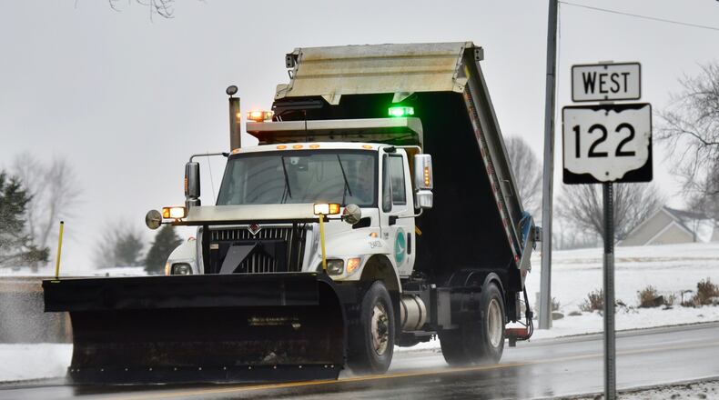 Salt trucks and snow plows worked on roads as a wintry mix fell on the area on Monday, Jan. 8, 2018. NICK GRAHAM / STAFF