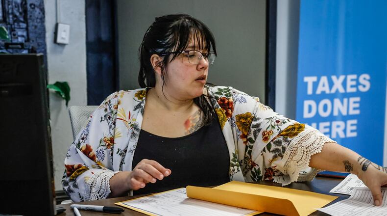 Jackson Hewitt tax professional Melissa Kolowena works on returns at the Third Street office in Dayton Monday April 3, 2023. JIM NOELKER/STAFF