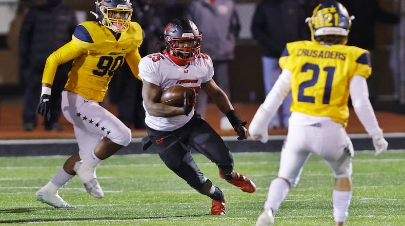Lakota West running back Cameron Goode carries the ball during their Division 1 playoff football game against Moeller Friday, Nov. 19, 2021 at Dwire Field at Atrium Stadium in Mason. NICK GRAHAM / STAFF