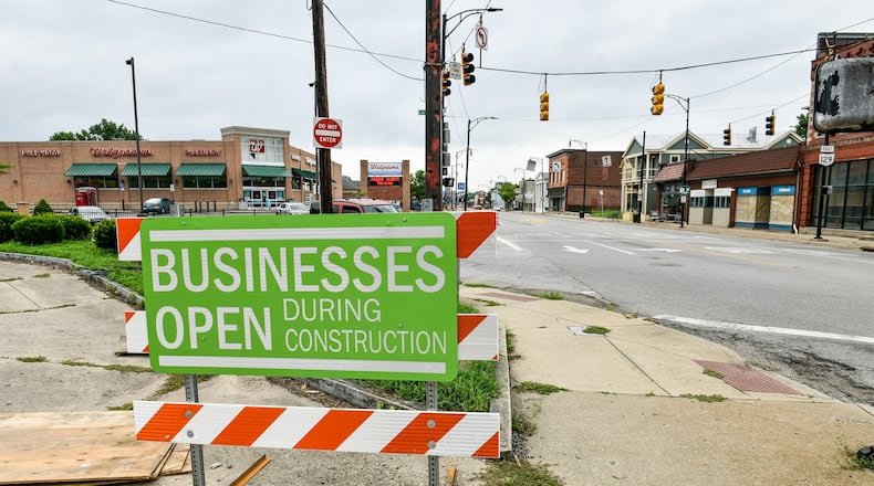 Business remain open during construction along Main Street in Hamilton.