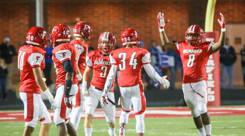 Fairfield running back James Mitchell (8) celebrates after returning a punt for a touchdown during a Division I playoff game against St. Xavier at Fairfield Stadium on Nov. 4, 2016. GREG LYNCH/STAFF
