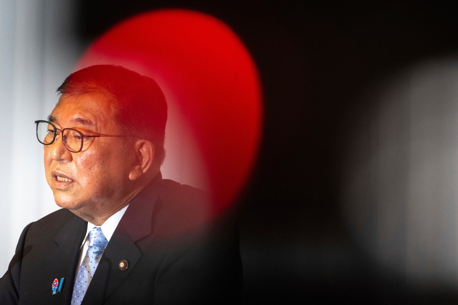 Japan's Prime Minister Shigeru Ishiba attends a press conference at the headquarters of the Liberal Democratic Party (LDP) in Tokyo Monday, July 21, 2025 after the prime minister's ruling coalition failed to secure a majority in the upper house in a parliamentary election. (Philip Fong/Pool Photo via AP)