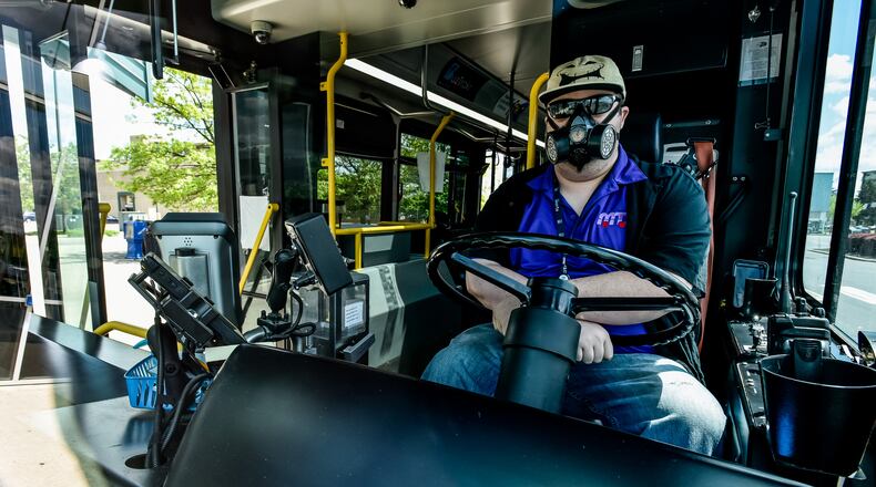 The Butler County Regional Transit Authority has had to make adjustments due to the coronavirus pandemic, as in this photo from the summer, but officials said they are still dedicated to getting people where they need to go. NICK GRAHAM / STAFF