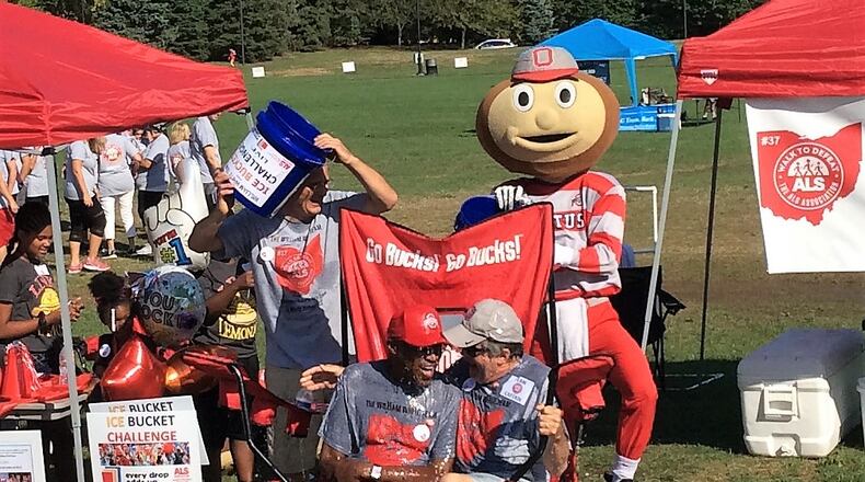 Former Ohio State football player William White, left in OSU hat, took the ice bucket challenge last year and this year will be joined by several former Buckeye coaches and players to raise money for the local ALS chapter. White has suffered with the disease for three years. CONTRIBUTED