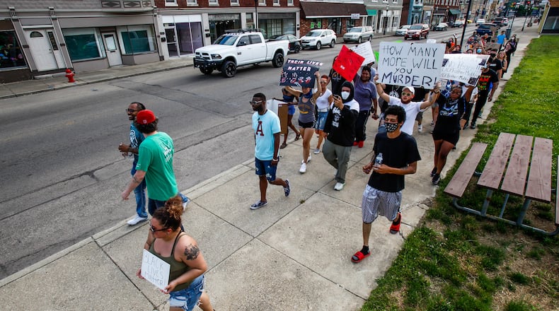 More than 75 people gathered Wednesday at the Middletown City Building for marches through downtown Middletown. The groups gathered in response to the death of George Floyd in police custody in Minnesota. NICK GRAHAM / STAFF