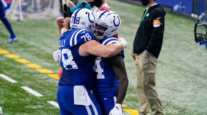 Indianapolis Colts wide receiver Zach Pascal (14) celebrates a touchdown with center Ryan Kelly (78) in the second half of an NFL football game against the Houston Texans in Indianapolis, Sunday, Dec. 20, 2020. (AP Photo/Darron Cummings)