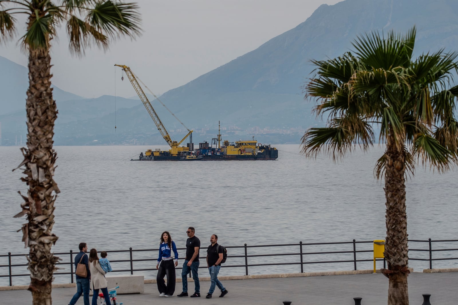 The multi-purpose floating work barge Hebo Lift 2 monitors the stretch of sea off Porticello, near Palermo, Sicily, Italy, Sunday, May 4, 2025, where the British superyacht Bayesian sunk on August 19, 2024 as the operations for its recovery start. (AP Photo/Salvatore Cavalli)
