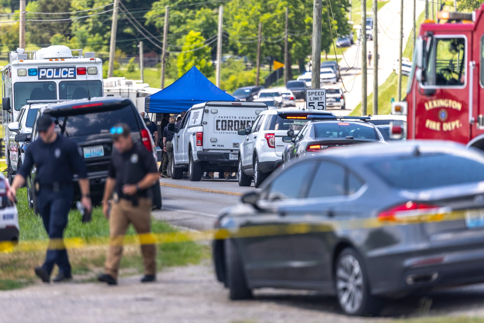 Law enforcement members respond to a shooting near Richmond Road Baptist Church in Lexington, Ky., Sunday, July 13, 2025. (Ryan C. Hermens/Lexington Herald-Leader via AP)