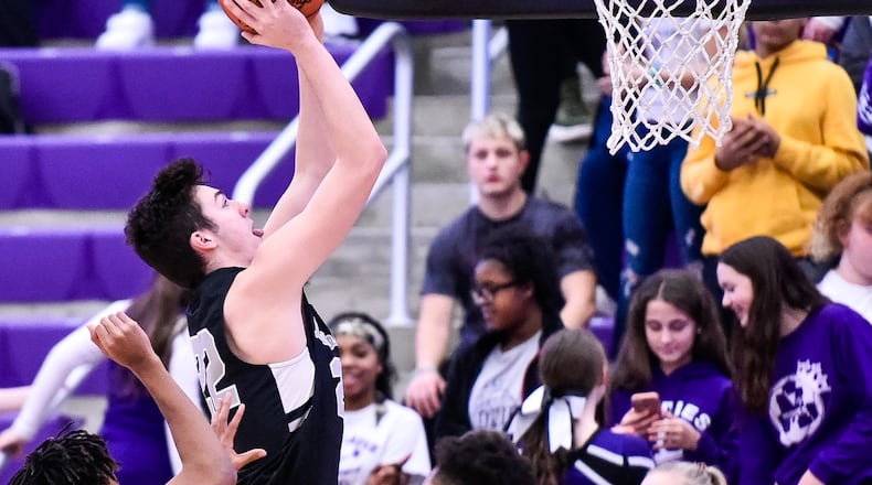 Lakota East’s Bash Wieland goes up for a shot during a basketball game against Middletown on Jan. 8 at Wade E. Miller Arena in Middletown. East won 61-47. NICK GRAHAM/STAFF