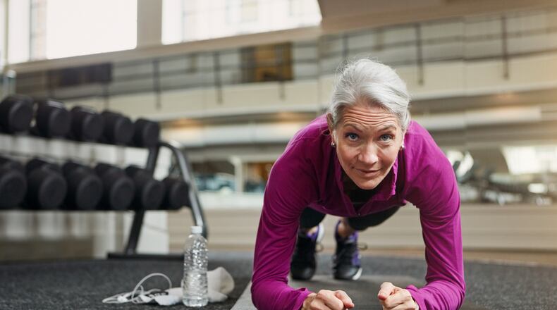 Planks involve the entire body and targets the core. Place forearms on the floor with elbows positioned under the shoulders. Then lift the hips so that the body makes a straight line from toes to head. iSTOCK/COX