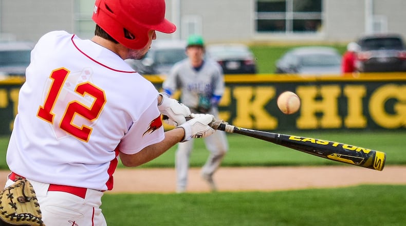 Fenwick’s Alan Nix gets a piece of the ball during Monday’s game against visiting Chaminade Julienne. NICK GRAHAM/STAFF