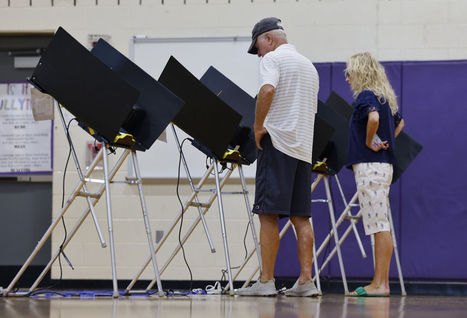 Terry and Bonnie Griffin vote with Issue 1 on the ballot Tuesday, Aug. 8, 2023 at Rosa Parks Elementary School in Middletown. NICK GRAHAM/STAFF