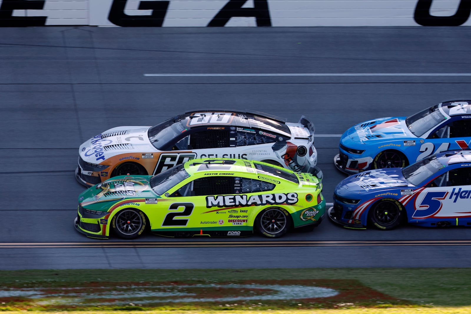 NASCAR Cup Series driver Austin Cindric (2) beats driver Ryan Preece (60) to the finish line during a NASCAR Cup Series auto race at Talladega Superspeedway, Sunday, April 27, 2025, in Talladega, Ala. (AP Photo/Butch Dill)