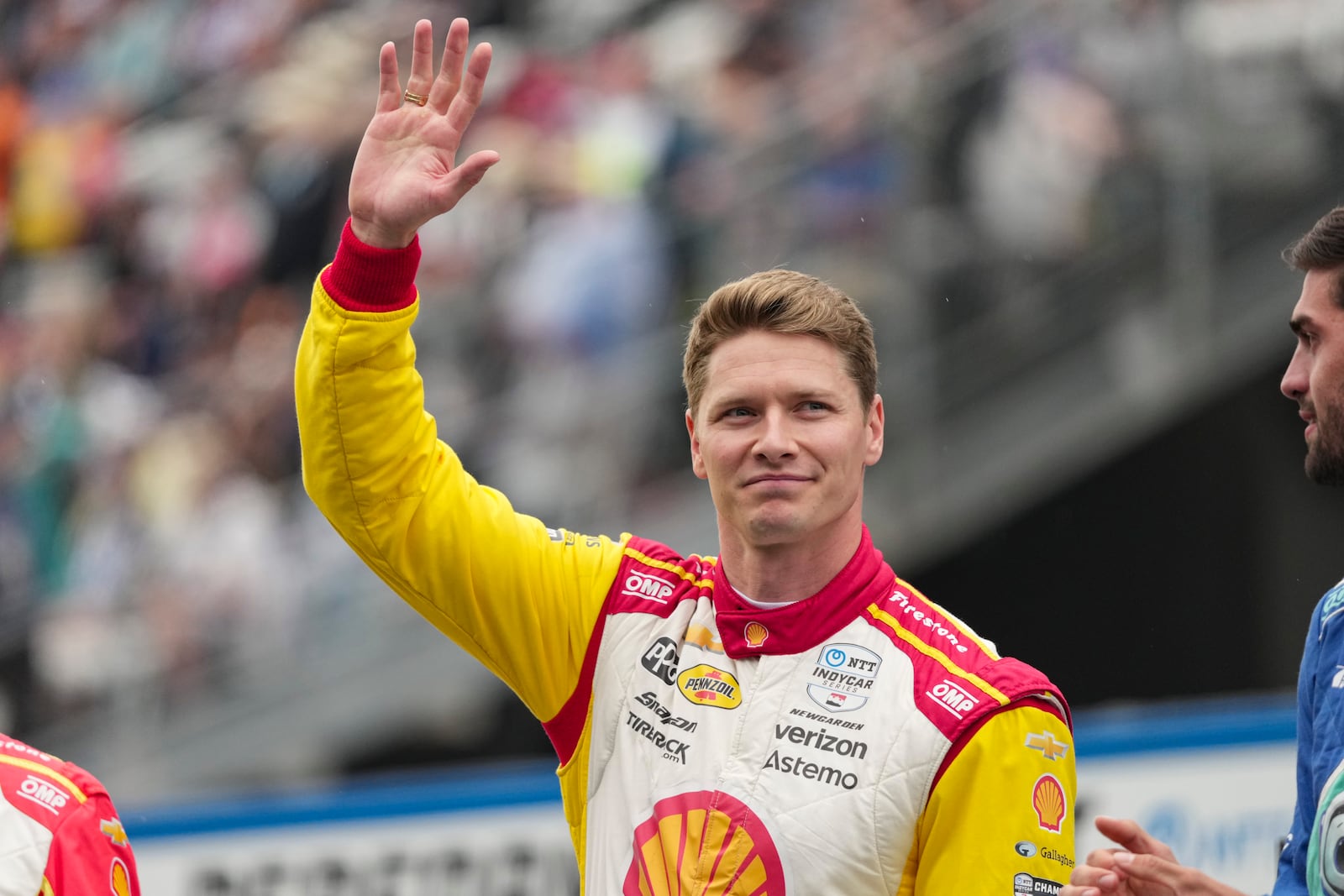 Josef Newgarden is introduced before the start of the Indianapolis 500 auto race at Indianapolis Motor Speedway in Indianapolis, Sunday, May 25, 2025. (AP Photo/AJ Mast)