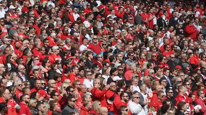 Fans stand for the national anthem on Opening Day before a Reds game against the Nationals on Thursday, March 28, 2024, at Great American Ball Park in Cincinnati. David Jablonski/Staff