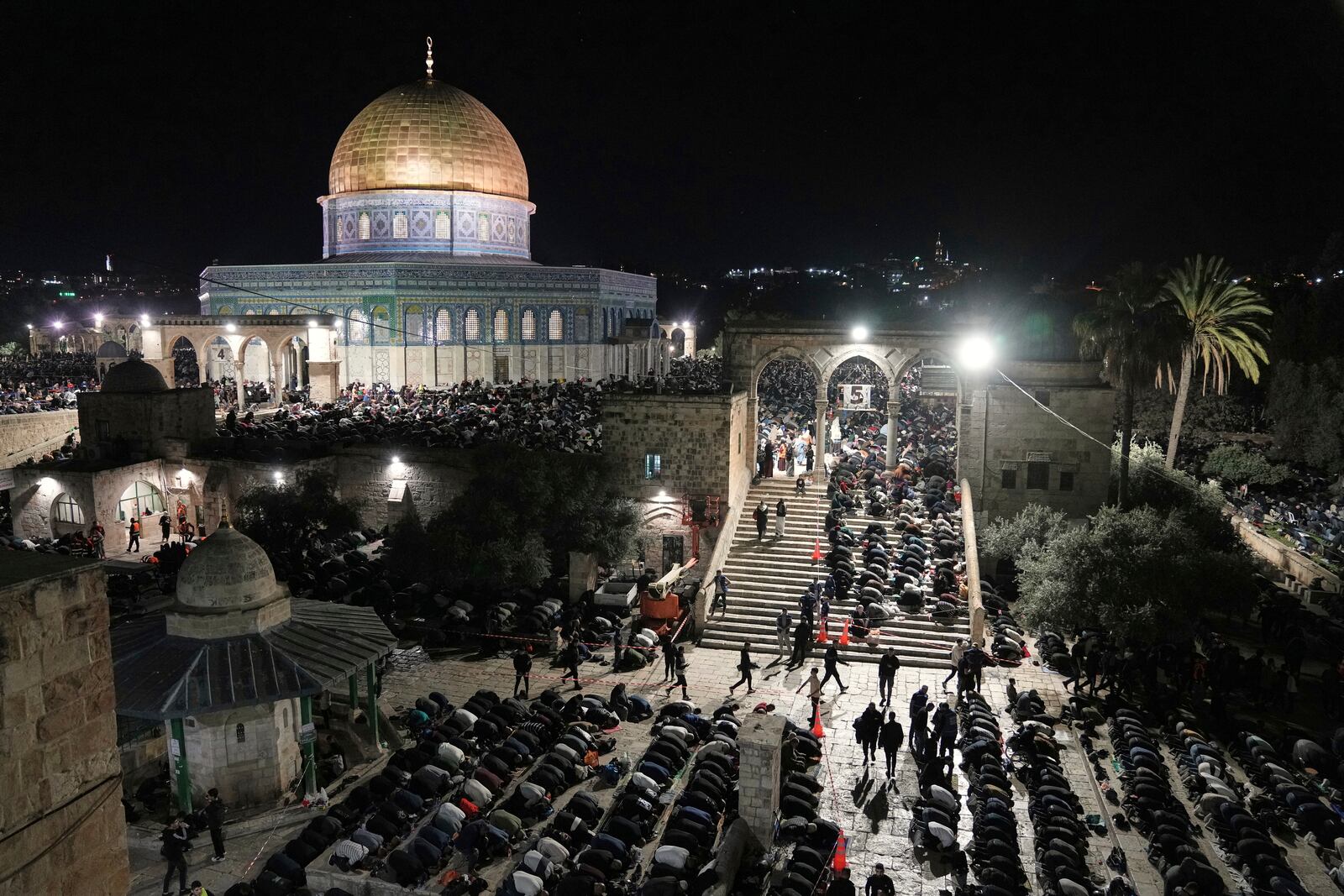 Palestinian Muslim worshippers pray during Laylat Al Qadr, also known as the Night of Power and marked on the 27th day of the holy fasting month of Ramadan, in front of the Dome of the Rock shrine at the Al-Aqsa Mosque compound in the Old City of Jerusalem, Wednesday, March 26, 2025. (AP Photo/Mahmoud Illean)