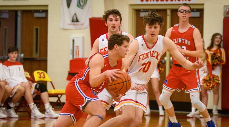 Fenwick’s A.J. Braun (20) defends Clinton-Massie’s Daulton Wolfe during Monday night’s game at Fenwick. The host Falcons won 67-48. ROB MCCULLEY/RAM PHOTOGRAPHY