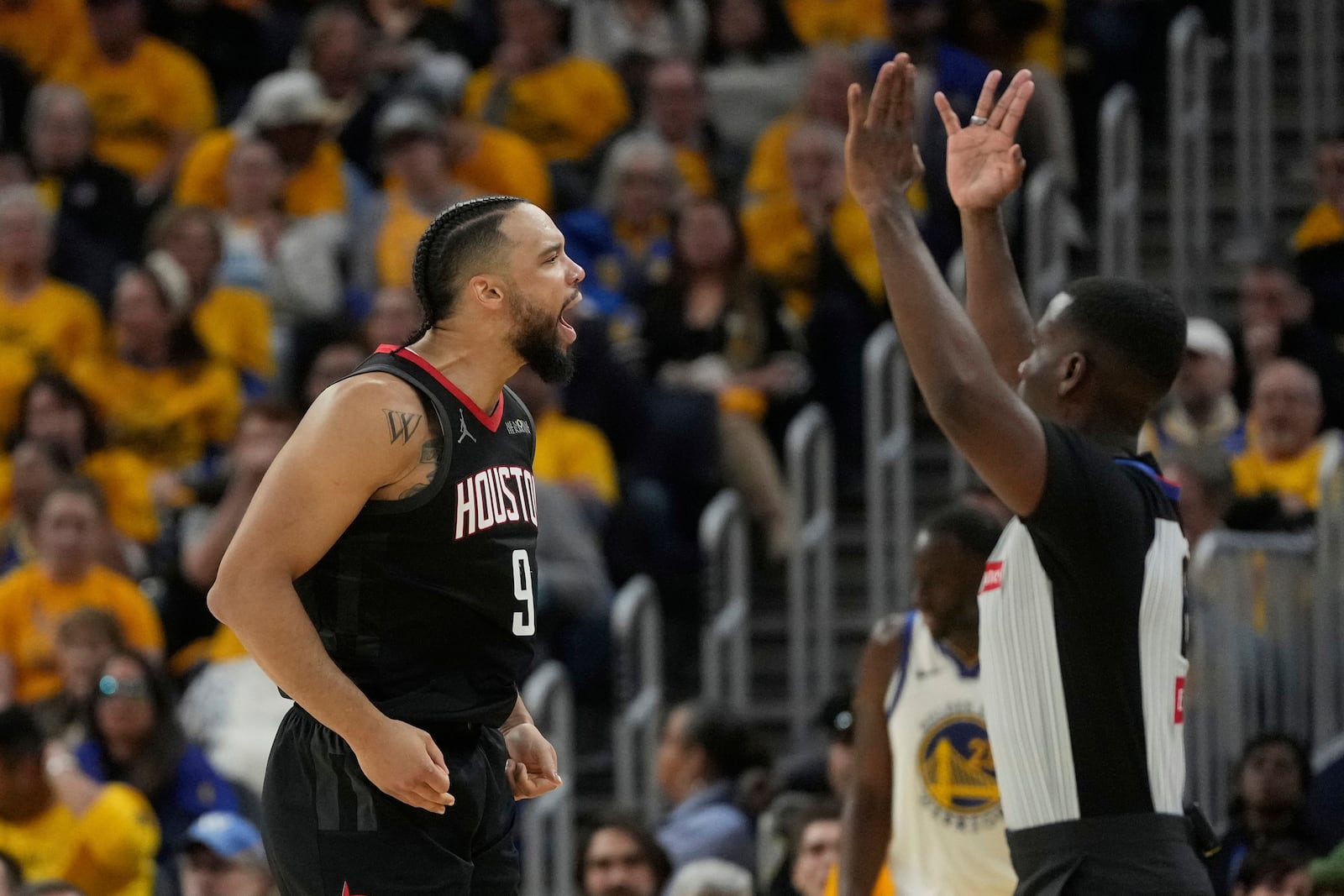 Houston Rockets forward Dillon Brooks reacts after scoring against the Golden State Warriors during the first half of Game 3 of an NBA basketball first-round playoff series in San Francisco, Saturday, April 26, 2025. (AP Photo/Jeff Chiu)