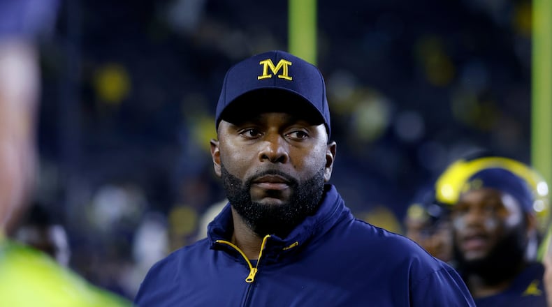 FILE - Michigan coach Sherrone Moore walks off the field following an NCAA football game on Saturday, Aug. 30, 2025, in Ann Arbor, Mich. (AP Photo/Al Goldis, File)