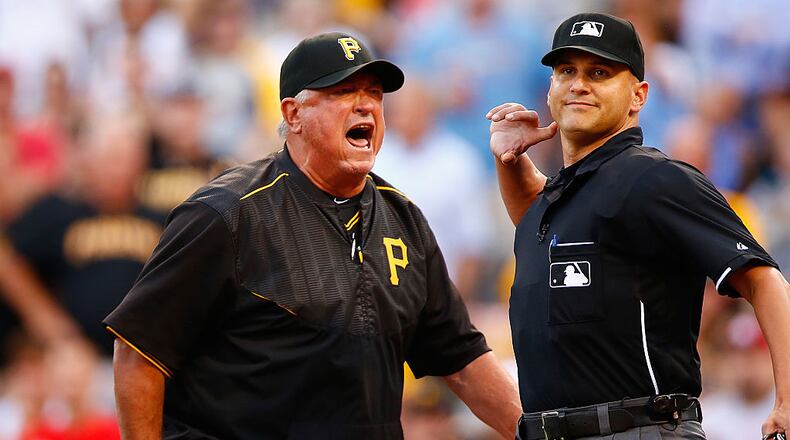PITTSBURGH, PA - JULY 11: Manager Clint Hurdle #13 of the Pittsburgh Pirates is ejected by home plate umpire Vic Carapazza in the second inning following a called foul bal that resulted in a home run by Mark Reynolds #12 of the St Louis Cardinals during the game at PNC Park on July 11, 2015 in Pittsburgh, Pennsylvania. (Photo by Jared Wickerham/Getty Images)