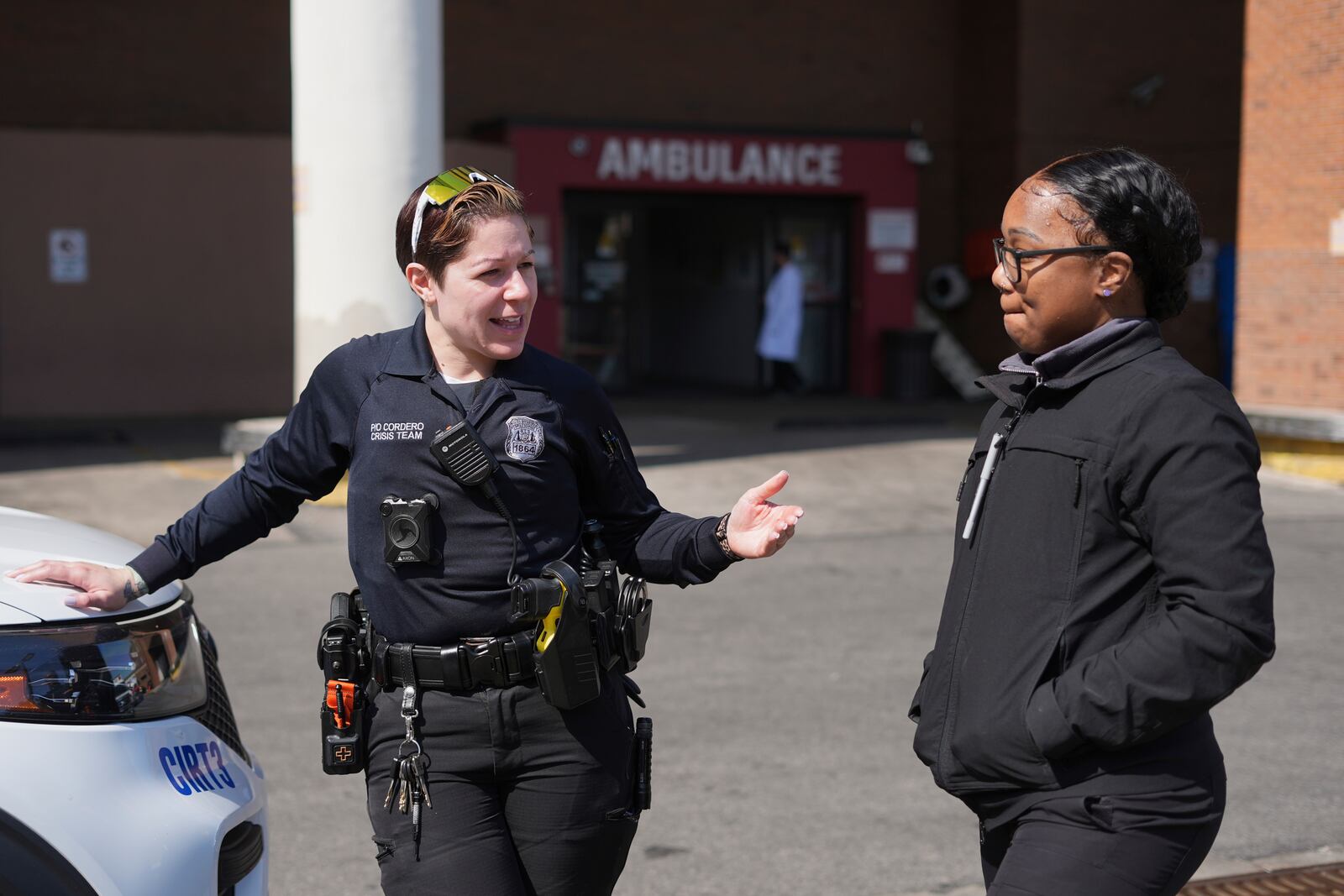 Crisis Intervention Response Team (CIRT) members Therapist Krystian Gardner, right, and Philadelphia Police Officer Vanity Cordero talk after convincing a person to go into hospital for mental health treatment in Philadelphia, Friday, March 14, 2025. (AP Photo/Matt Rourke)
