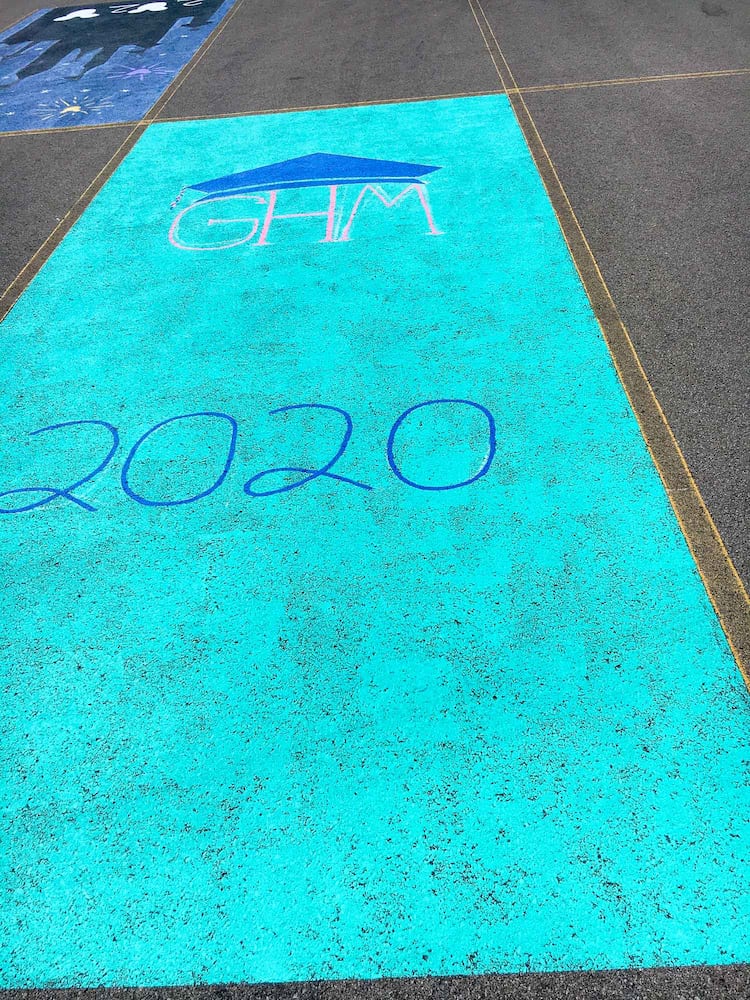 PHOTOS Lakota East seniors paint parking spots