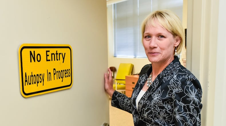 Butler County Coroner Dr. Lisa Mannix stands in the Butler County Morgue. Mannix was able to save taxpayers around $25,000 annually on lease payments for the morgue located on Fairgrove Avenue. NICK GRAHAM/STAFF