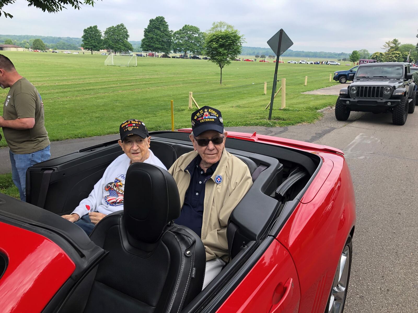 Two World War II veterans, Larry Reynolds, left, and Donald Saylor, wait for the Middletown Memorial Day Parade to begin Monday morning. They have been friends since elementary school. RICK McCRABB/STAFF
