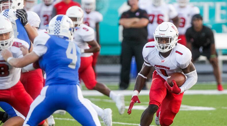 Lakota West’s David Afari runs with the ball during their football game against Hamilton Friday, Sept. 13, 2019 at Virgil M. Schwarm Stadium in Hamilton. Lakota West won 33-13. NICK GRAHAM/STAFF