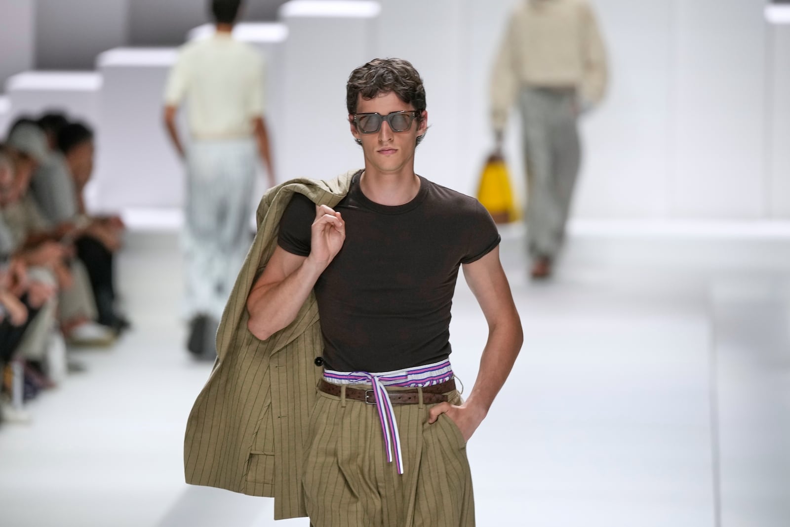 A model wears a creation as part of the men's Dolce & Gabbana Spring-Summer 2026 collection, that was presented in Milan, Italy, Saturday, June 21, 2025. (AP Photo/Luca Bruno)