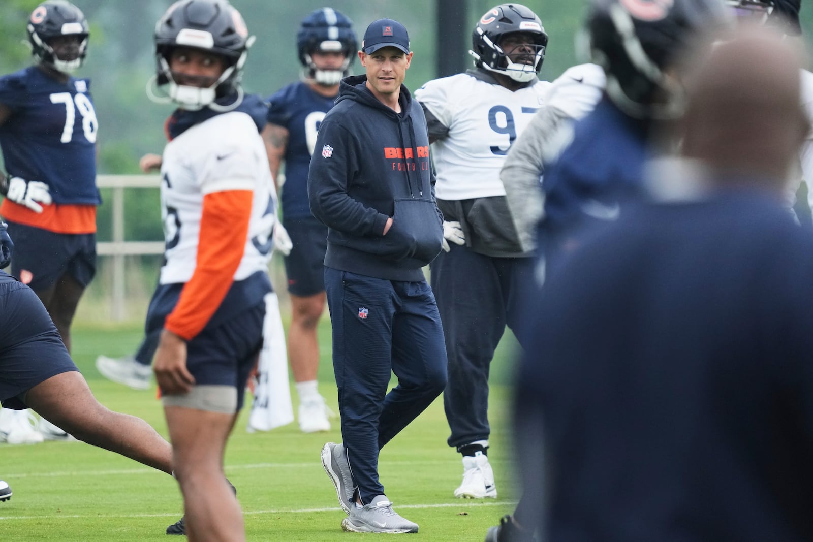 FILE - Chicago Bears head coach Ben Johnson watches players during NFL football practice at Halas Hall in Lake Forest, Ill., June 4, 2025. (AP Photo/Nam Y. Huh, File)