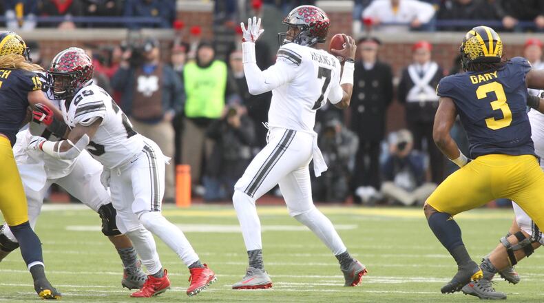 Ohio State’s Dwayne Haskins throws a 27-yard pass to Austin Mack in the third quarter against Michigan on Saturday, Nov. 25, 2017, at Michigan Stadium in Ann Arbor, Mich. David Jablonski/Staff