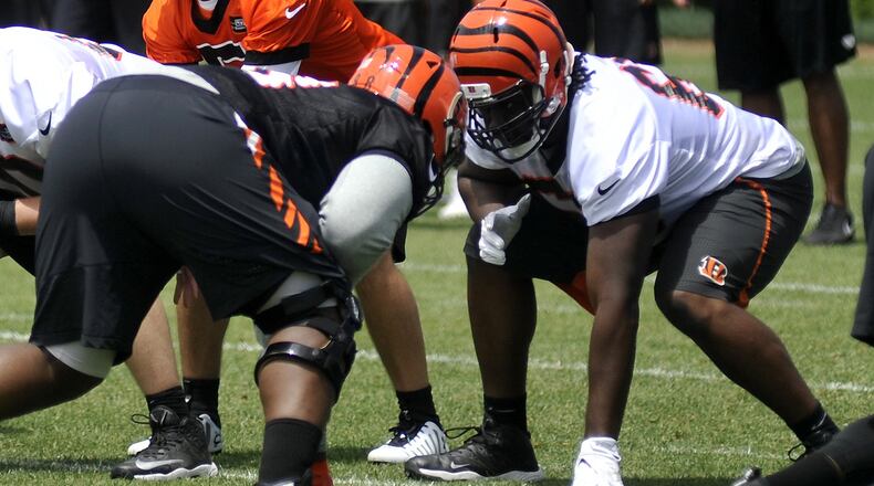 Cincinnati Bengals offensive lineman Trey Hopkins (right) has played all five positions this spring. JAY MORRISON/STAFF