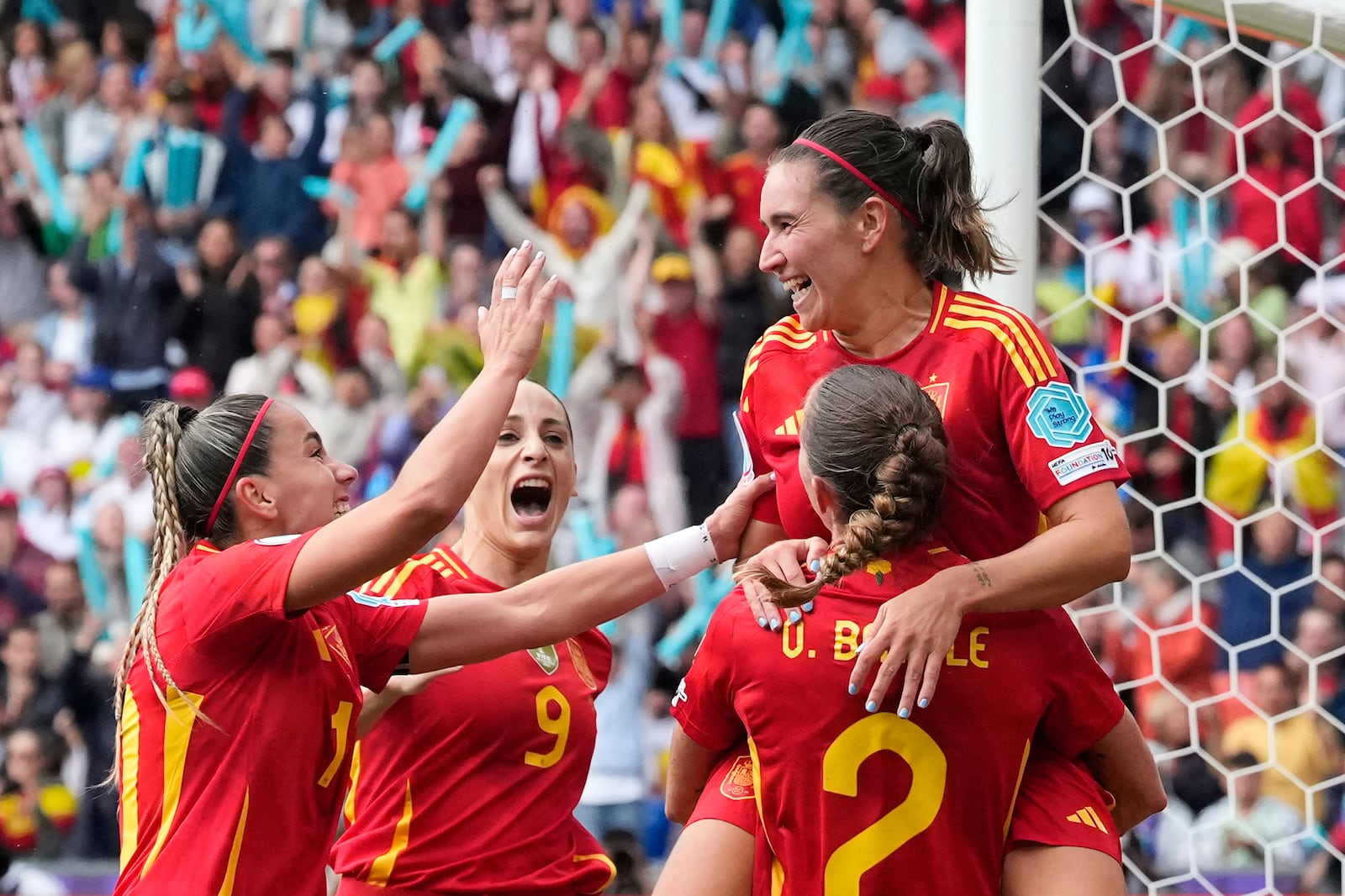 Spain players celebrate after Spain's Mariona Caldentey, right, scored the opening goal during the Women's Euro 2025 final soccer match between England and Spain at St. Jakob-Park in Basel, Switzerland, Sunday, July 27, 2025. (AP Photo/Alessandra Tarantino)
