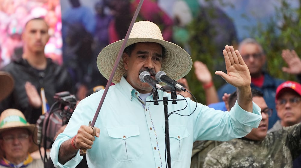 President Nicolas Maduro addresses supporters during a rally marking the anniversary of the Battle of Santa Ines, which took place during Venezuela's 19th-century Federal War, in Caracas, Venezuela, Wednesday, Dec. 10, 2025. (AP Photo/Ariana Cubillos)