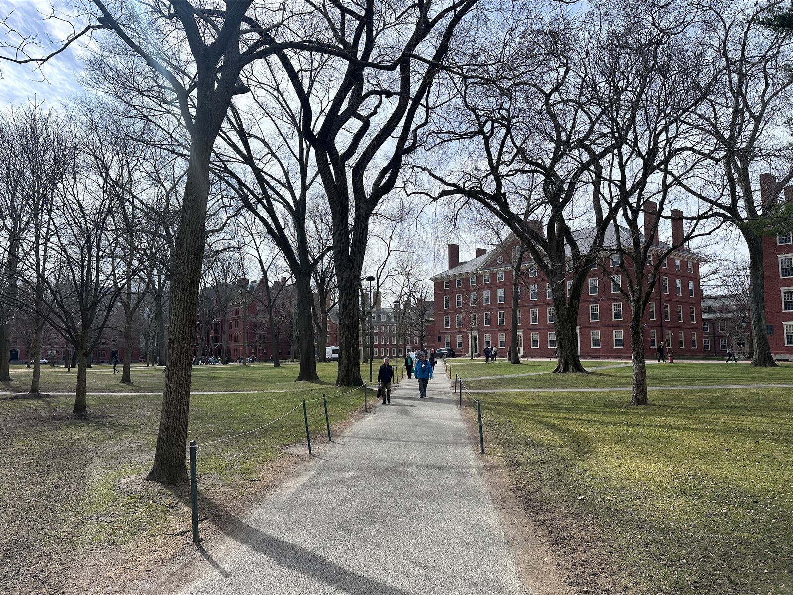 FILE - People walk through the campus of Harvard University in Cambridge, Mass., March 18, 2025. (AP Photos/Michael Casey, File)