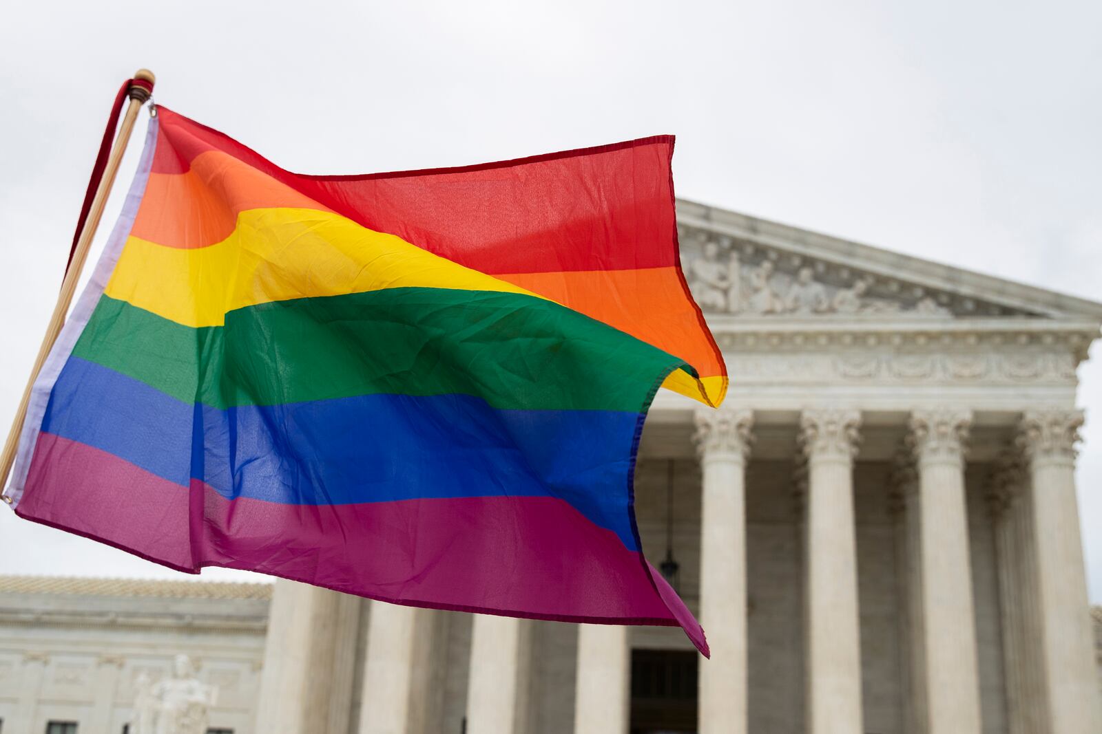 FILE - A pride flag is seen in front of the U.S. Supreme Court, Oct. 8, 2019, in Washington. (AP Photo/Manuel Balce Ceneta, File)