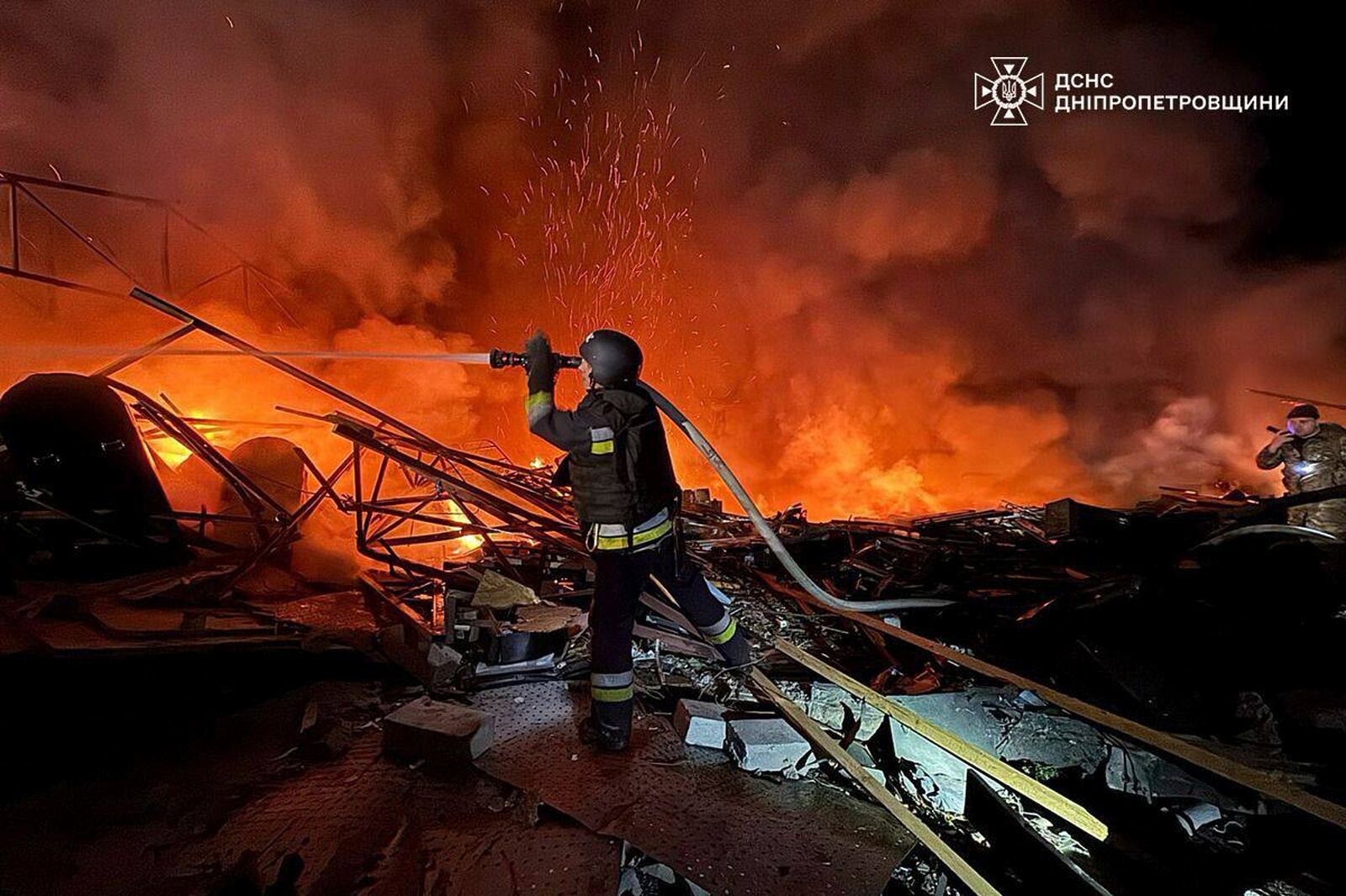 In this photo provided by the Ukrainian Emergency Service, firefighters put out the fire following Russia's drones attack in Kamianske, Dnipropetrovsk region, Ukraine, Wednesday, April 16, 2025. (Ukrainian Emergency Service via AP)