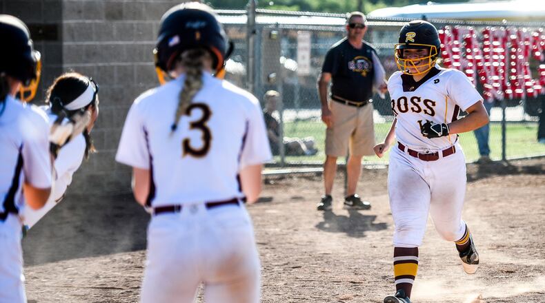 Whitley Arno (15) is greeted by her Ross teammates at home plate after hitting a grand slam during their Division II sectional final against Wilmington on Tuesday at Kings. NICK GRAHAM/STAFF