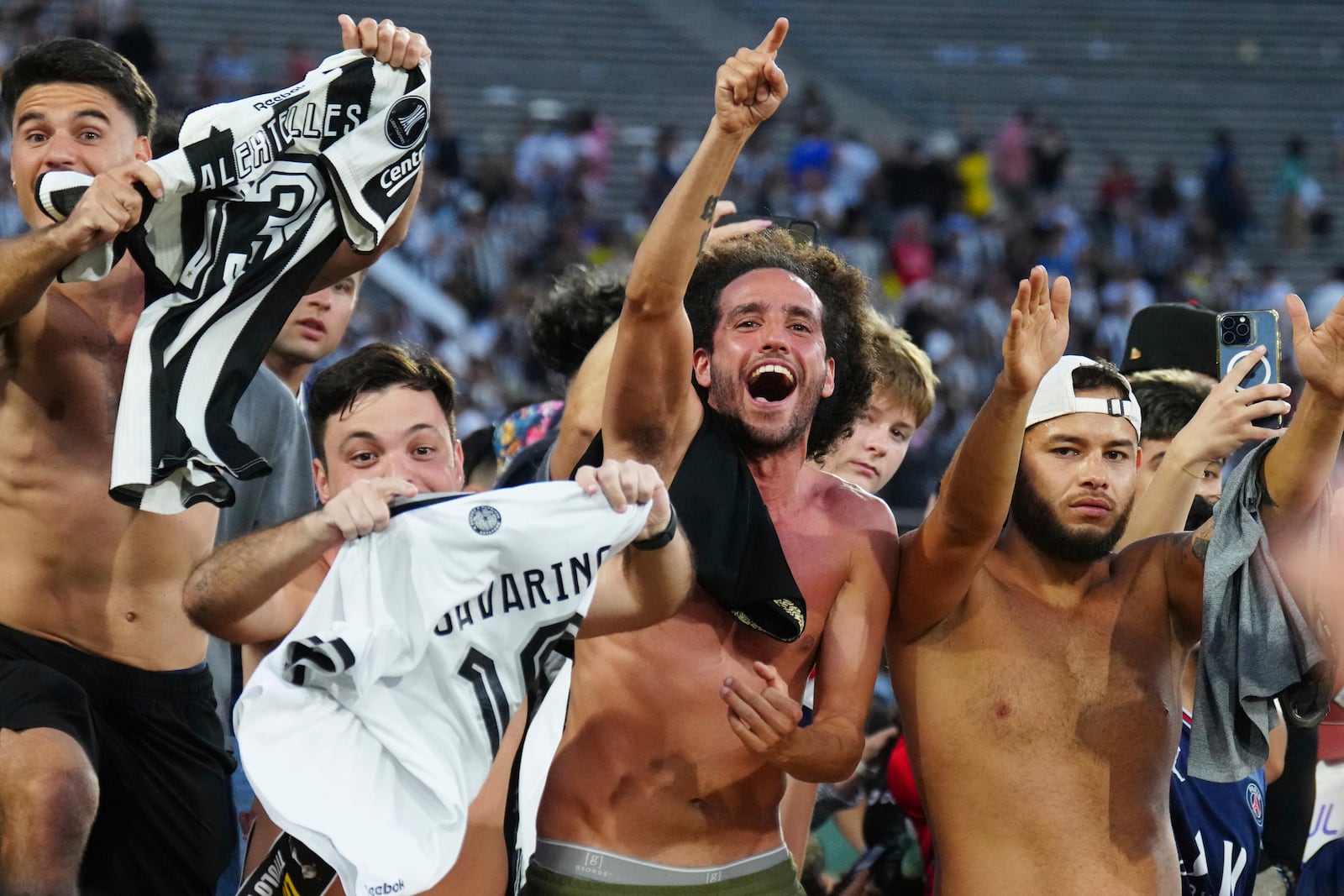 Fans celebrate after Botafogo won the Club World Cup group B soccer match between PSG and Botafogo in Pasadena, Calif., Thursday, June 19, 2025. (AP Photo/Jae C. Hong)