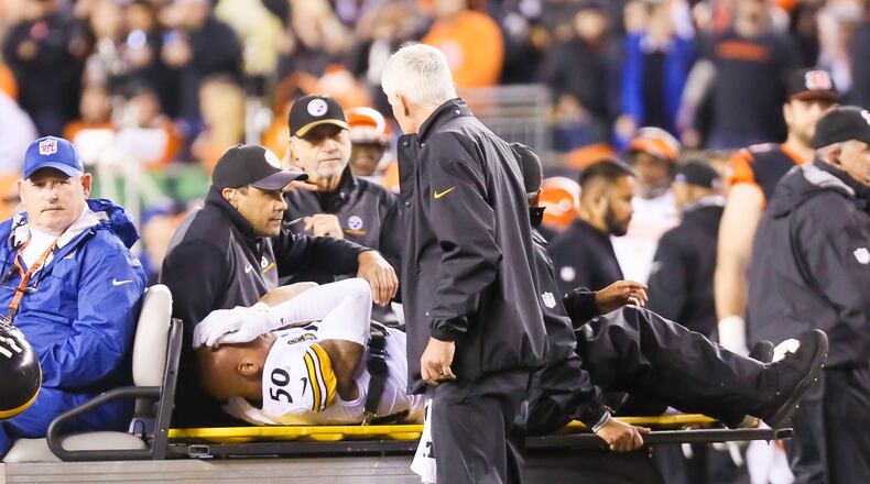 Steelers linebacker Ryan Shazier is injured on a catch by Bengals wide receiver Josh Malone (80) during the first half of their game at Paul Brown Stadium, Monday, Dec. 4, 2017. GREG LYNCH / STAFF