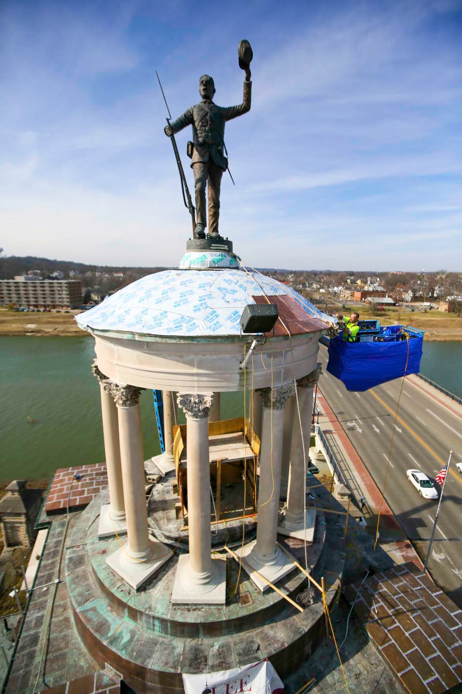 Kelly Wright of Lee Restoration works on The Soldiers, Sailors and Pioneers monument in downtown Hamilton, Monday, Feb. 6, 2017. The monument is getting a shiny new copper dome, a contingency not originally contemplated in the $361,000 restoration project. GREG LYNCH / STAFF