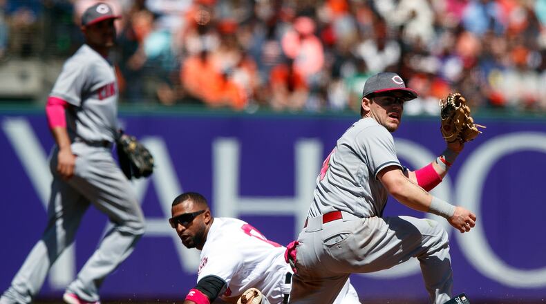 SAN FRANCISCO, CA - MAY 14: Eduardo Nunez #10 of the San Francisco Giants steals second base ahead of a tag from Scooter Gennett #4 of the Cincinnati Reds during the fifth inning at AT&T Park on May 14, 2017 in San Francisco, California. The San Francisco Giants defeated the Cincinnati Reds 8-3. Players are wearing pink to celebrate Mother’s Day weekend and support breast cancer awareness. (Photo by Jason O. Watson/Getty Images)