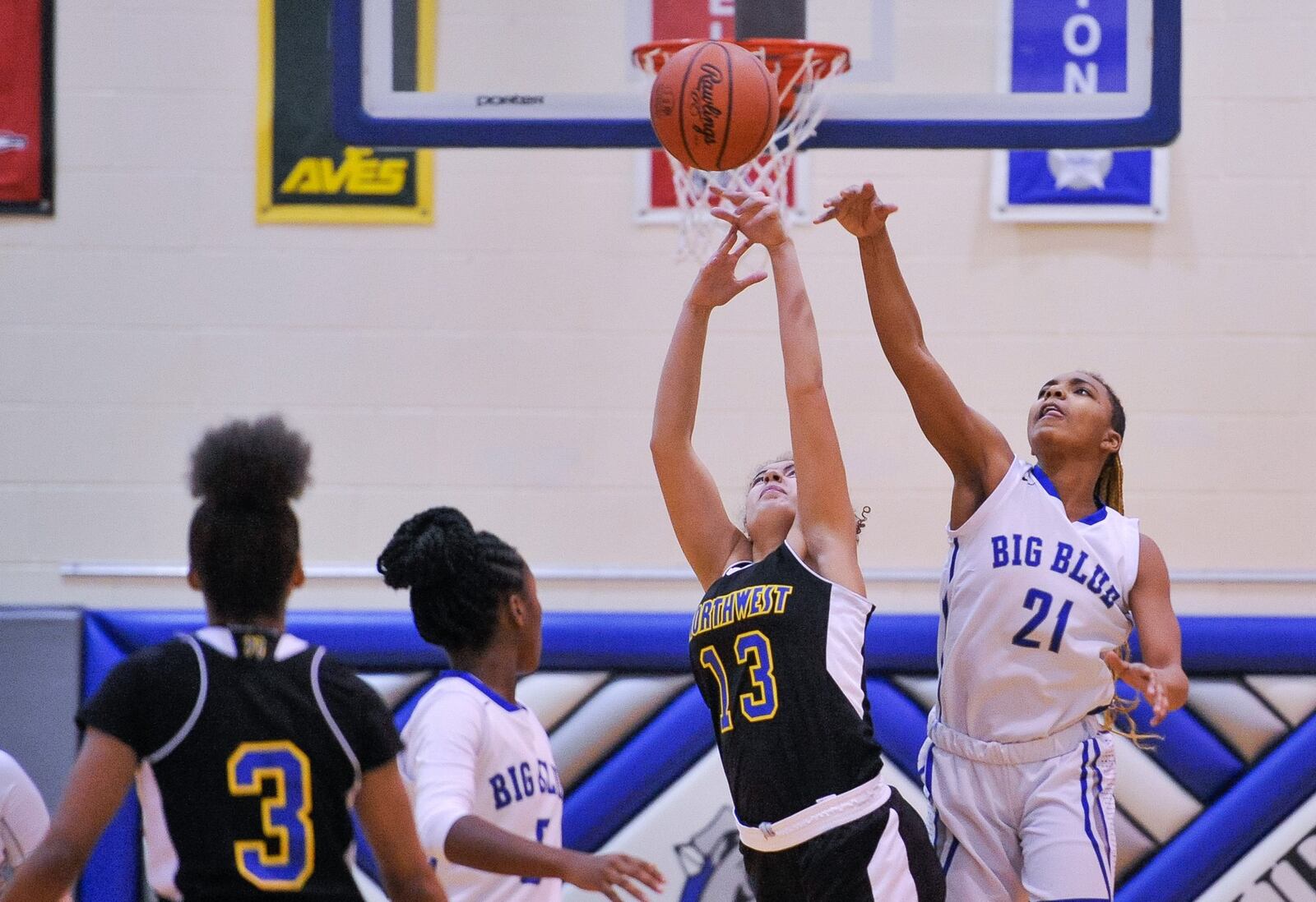 Hamilton’s CiCi Riggins (21) knocks the basketball away from Northwest’s Sierra Boyd during a game Dec. 27, 2018, at the Hamilton Freshman School. Northwest won 62-51. NICK GRAHAM/STAFF